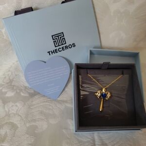 Theceros Sapphire and Yellow gold Cross with angel wings necklace